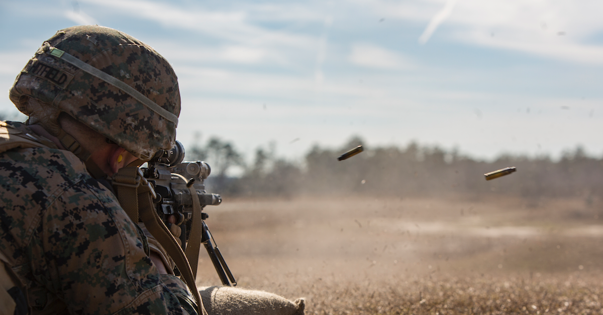 soldier firing automatic weapon