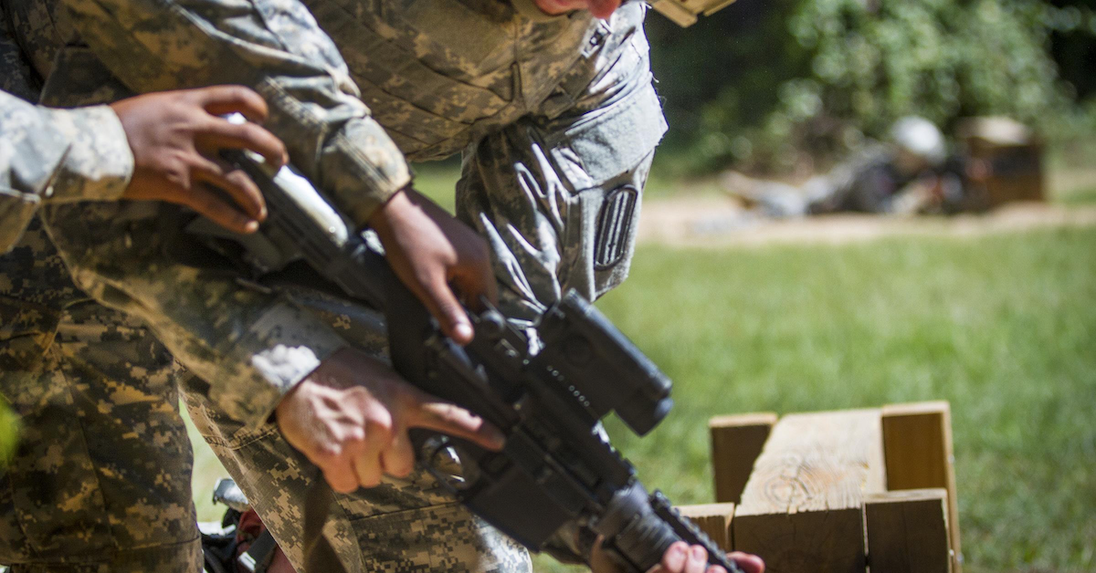 A soldier holds an M164A outside during training