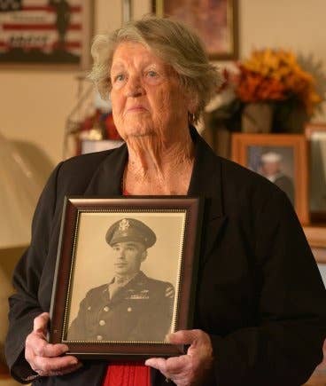 Pauline Conner, an 89-year-old resident of Clinton County, Kentucky, holds the photo of her late husband, 1st Lt. Garlin Murl Conner.