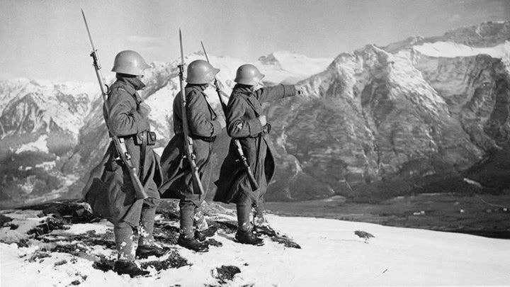 Swiss troops patrol their border in the Alps during World War II.