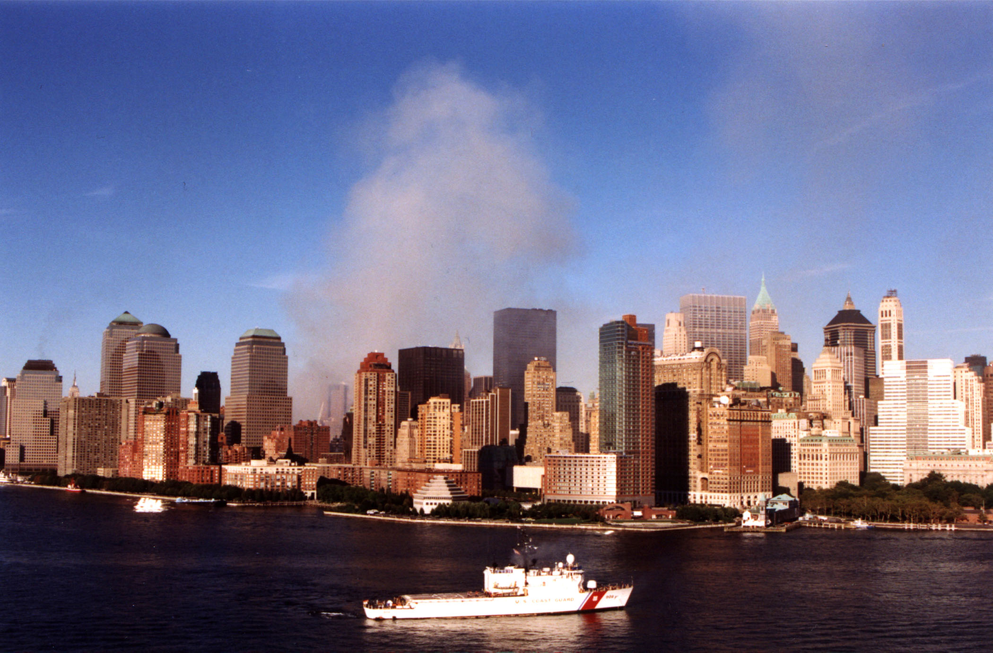 Cutter Tahoma deployed to New York Harbor on Sept. 11, 2001, and smoke emanating from the remains of the World Trade Towers.