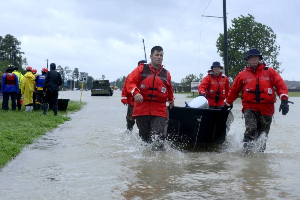 Maritime Safety and Security Team members deployed to Houston with a punt boat during Hurricane Harvey rescue operations.