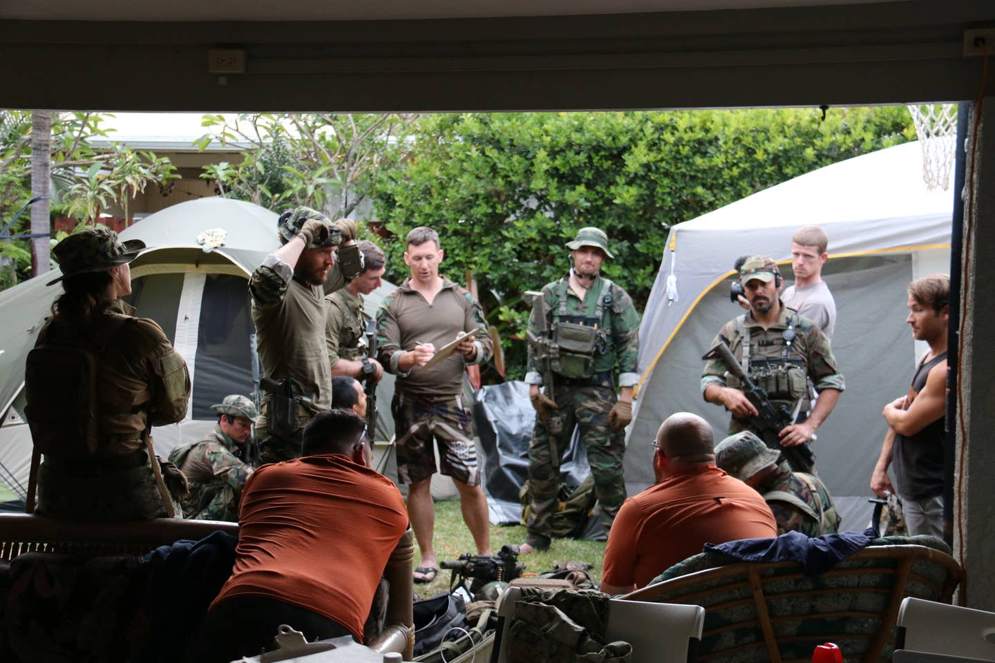 Back at base camp, Travis Haley conducts tactical training.