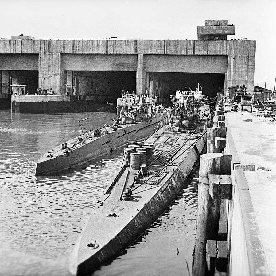 Captured German U-boats sit after the war. The one on the right is a Type IX similar to U-864. (Imperial War Museums)