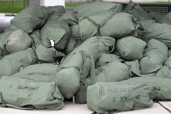A pile of duffel bags at the start of army deployment