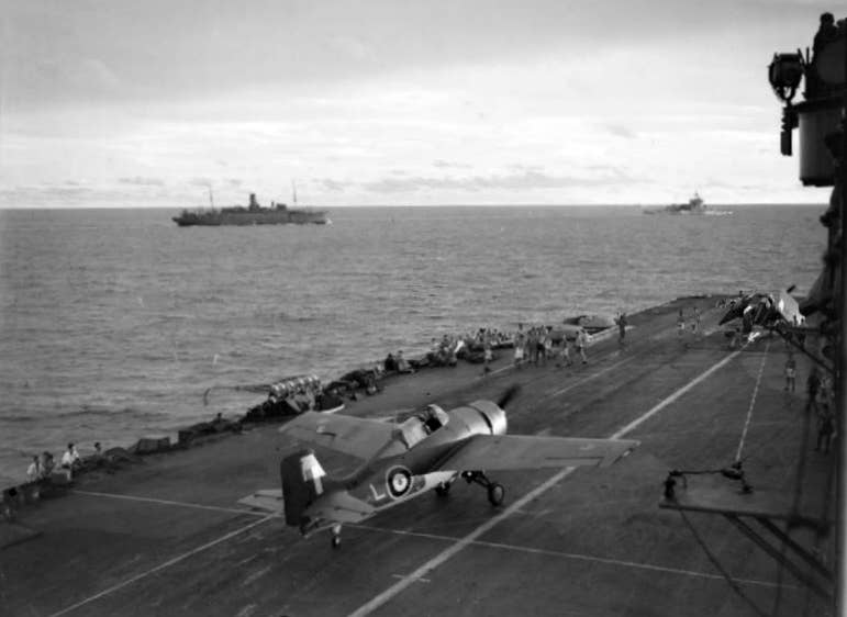After landing a Royal Navy Grumman Martlet of 888 Squadron, Fleet Air Arm is seen taxiing along the flight deck of HMS Formidable (67) to the forward hangar.
