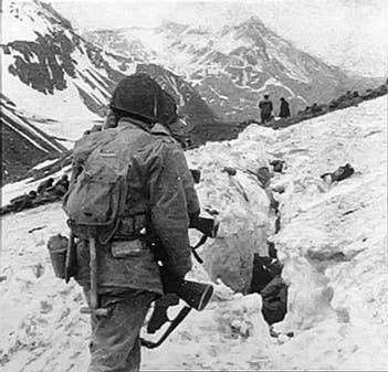 U.S. Army troops navigate the mountains of Attu Island in Alaska in May, 1943.<br>(Australian Army)