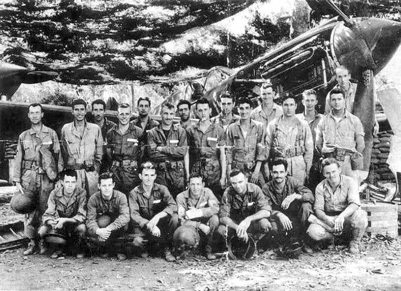​Army air crews pilots and ground personnel pose in front of a P-40 pursuit aircraft in the Philippines in 1942, just before the islands were conquered by Japan.<br>(U.S. Army Air Corps)
