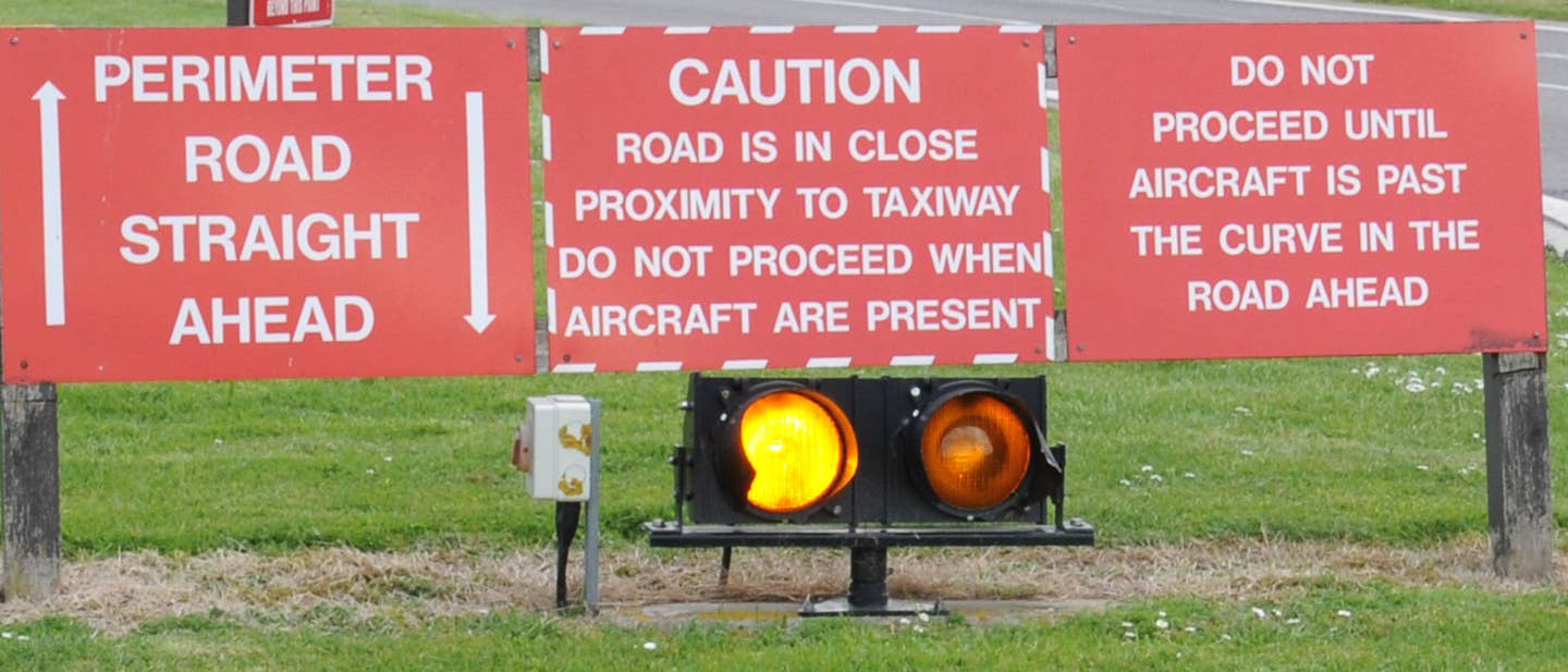 Fun Fact: The Air Force took this photo for an entire news story about this one spot on Royal Air Force Mildenhall, England, where unobservant drivers can actually shut down a runway by driving down the road when it isn't their turn.<br>(U.S. Air Force Gina Randall)