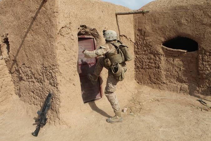 There's a certain finesse required to kicking in a door that only our brothers would find admirable. (U.S. Marine Corps)