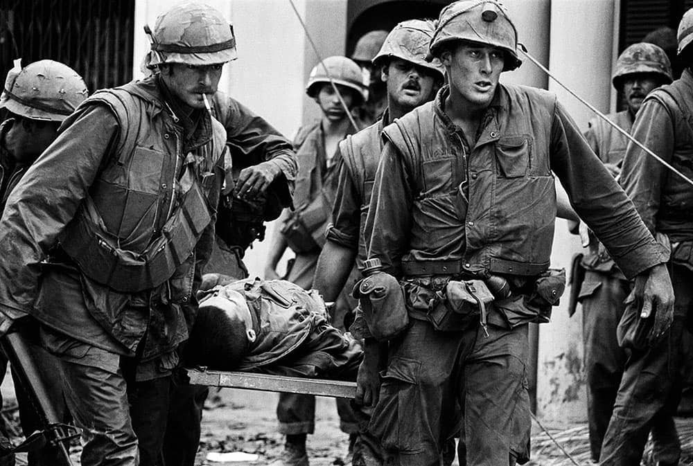 US Marines inside the Citadel in Hue City rescue the body of a dead Marine during the Tet Offensive.<br>(Photo via Flickr)