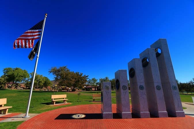The Army pillar is 17 ft tall, the shadow on the ground reaches 7ft off the base of the monument, and the Coast Guard pillar is 6 ft tall — because 17-7-6.<br>​(Anthem Community Council)