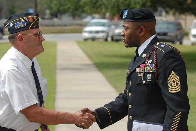 It may seem awkward at first, but it really does mean a lot to tell another veteran that you're thankful for their service.<br>(U.S. Army photo by Spc. Michael Adams)