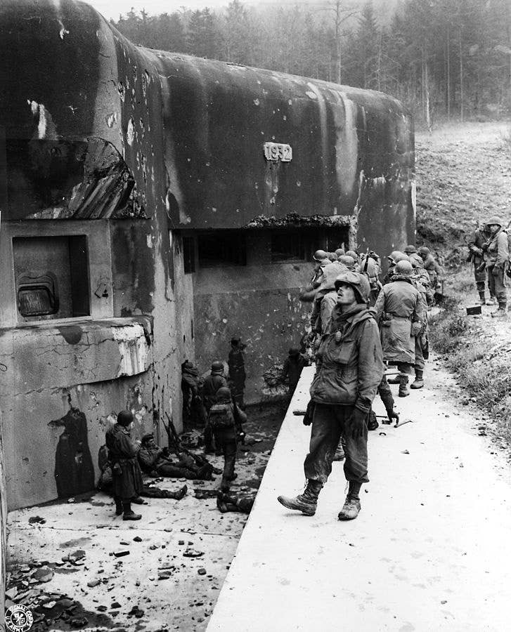 American troops look at Maginot Line defenses during the drive to Berlin in 1944.<br>(U.S. Army Signal Corps)