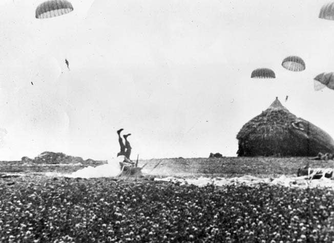 An American paratrooper makes a hard landing in a Dutch field during the airborne phase of Operation Market Garden, September, 1944.