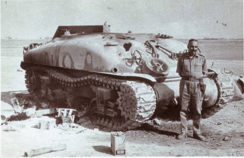 A military officer stands with a destroyed, American-made Sherman tank during the Indo-Pakistani War. At Assal Uttar, Indian Sherman and Centurion tanks took on American-made Patton tanks and annihilated them.  (Public Domain)