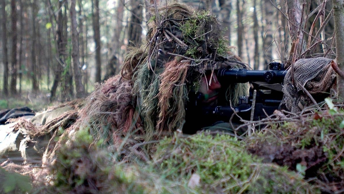 A German Special Forces soldier lines his sites on a target 500 meters away, and awaits direction from an International Special Training Centre instructor to engage the target in 2006. (U.S. Army Staff Sgt. Gina Vaile-Nelson)