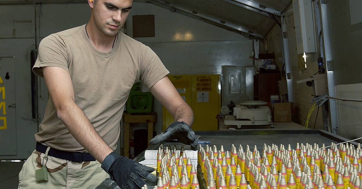 Airman 1st Class Anthony Meyerhoffer inspects and counts 20 mm high-explosive incendiary rounds.<br>(U.S. Air Force photo by Tech. Sgt. Demetrius Lester)