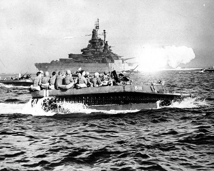 The battleship USS Tennessee bombards Okinawa as troops move forward to land. (U.S. Navy History and Heritage Command)