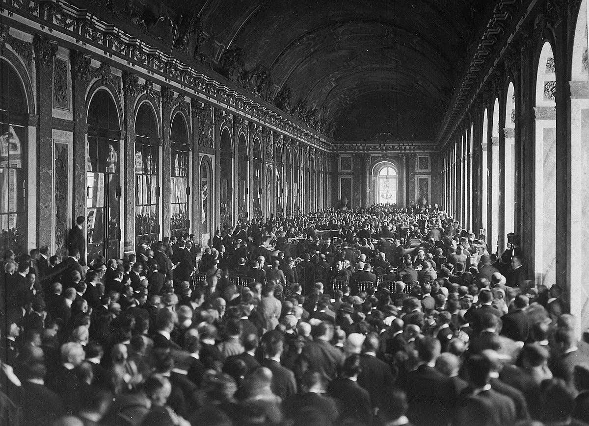Delegates sign the Treaty of Versailles on June 29, 1919, ending World War I. Outcry rose from French military leaders who predicted that Germany would come back from the defeat and invade Europe again. (U.S. National Archives)​