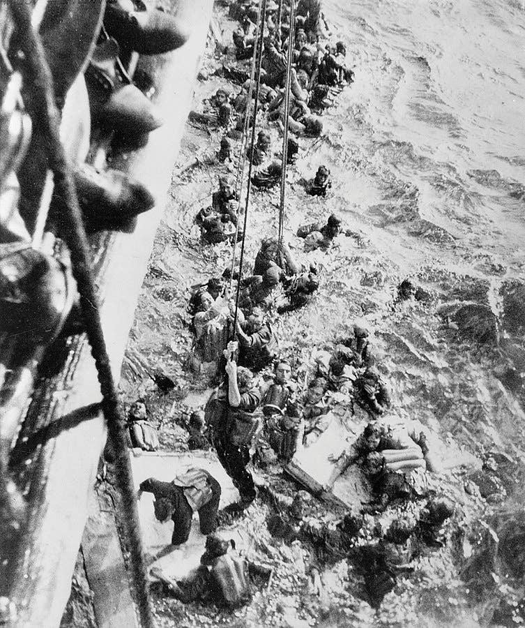 The HMS Dorestshire rescues survivors of the Bismarck. Only about 114 sailors made it out. (Royal Navy)