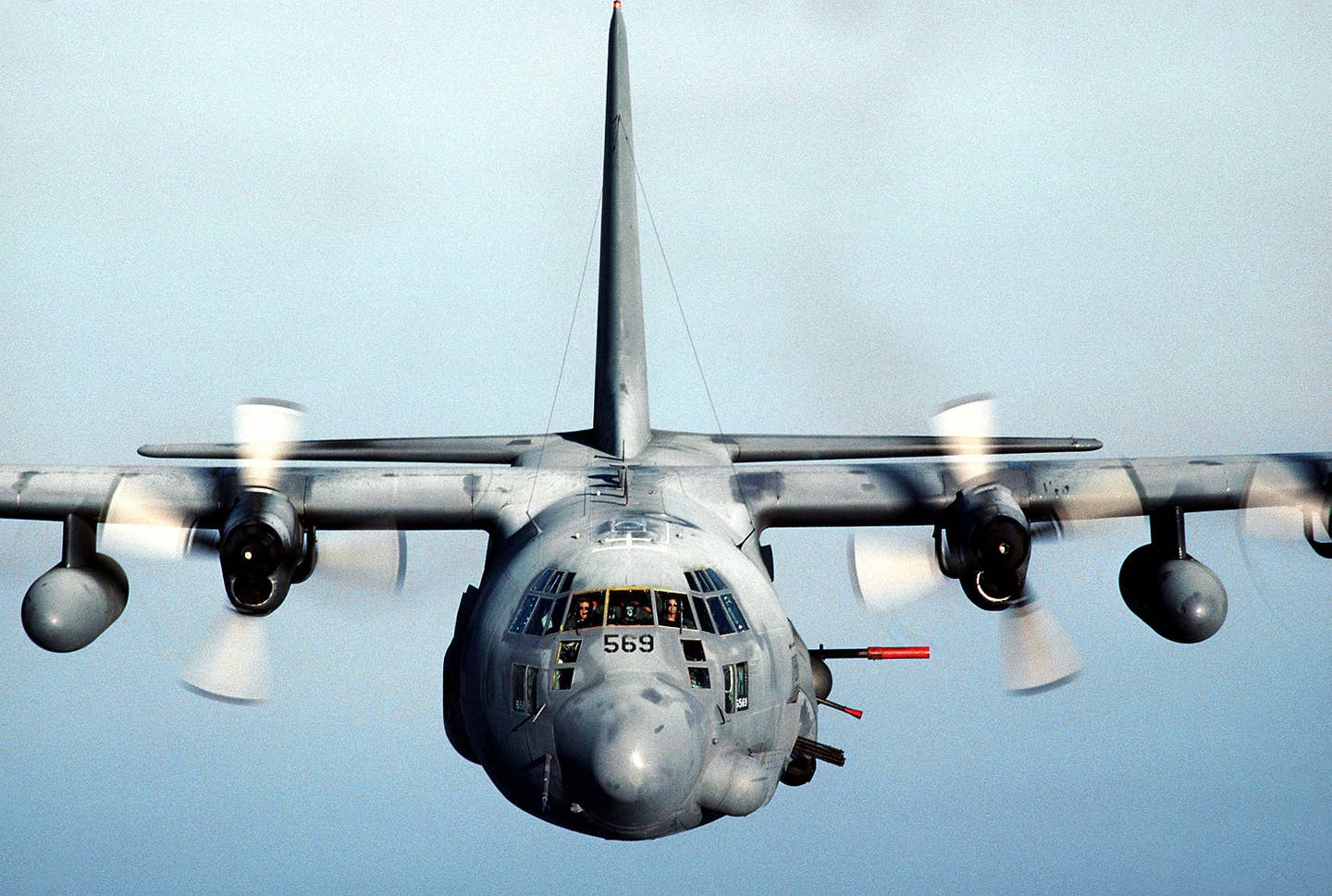 An AC-130H Spectre in-flight with its guns visible towards the right side of the picture (US Air Force photograph by TSgt. Lee Schading)