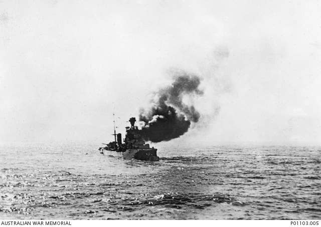 An Italian ship burns in the Mediterranean while under fire from an Allied vessel. (Australian War Memorial)