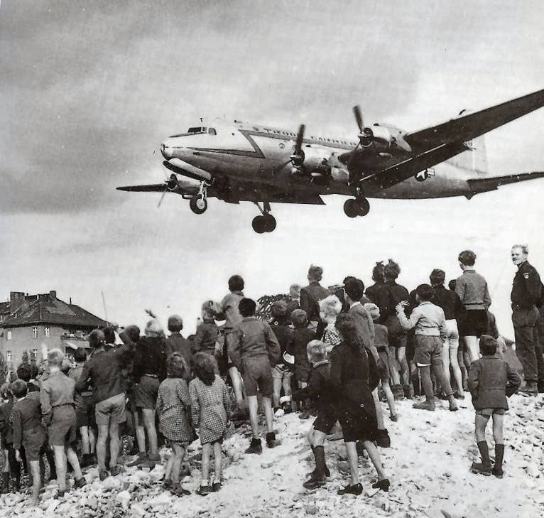 A C-54 flies into Berlin's Tempelhof Airport in 1948 as part of the Berlin Airlift. (U.S. Air Force Henry Ries)
