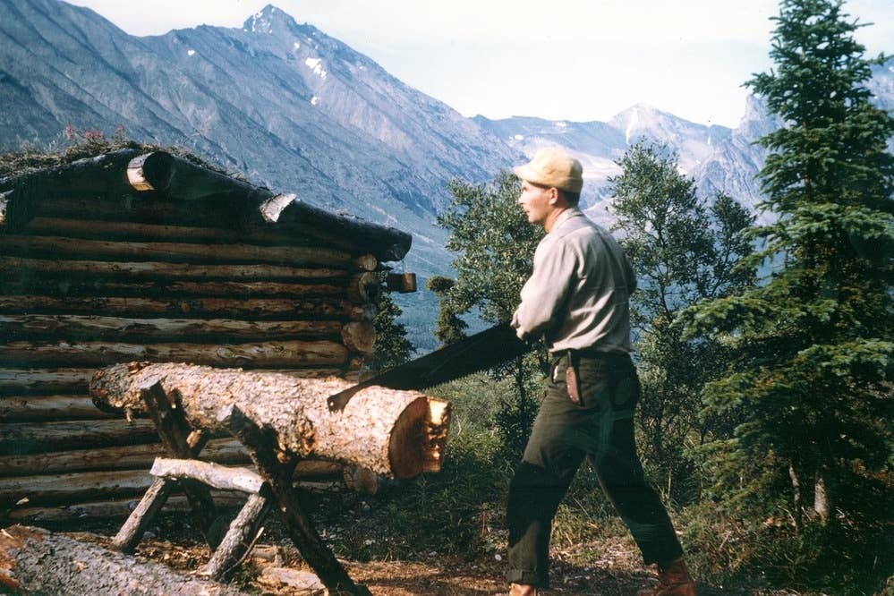 Dick Proenneke hard at work in Twin Lakes, Alaska. (National Parks Service photo taken by Richard Proenneke and donated by Raymond Proenneke)