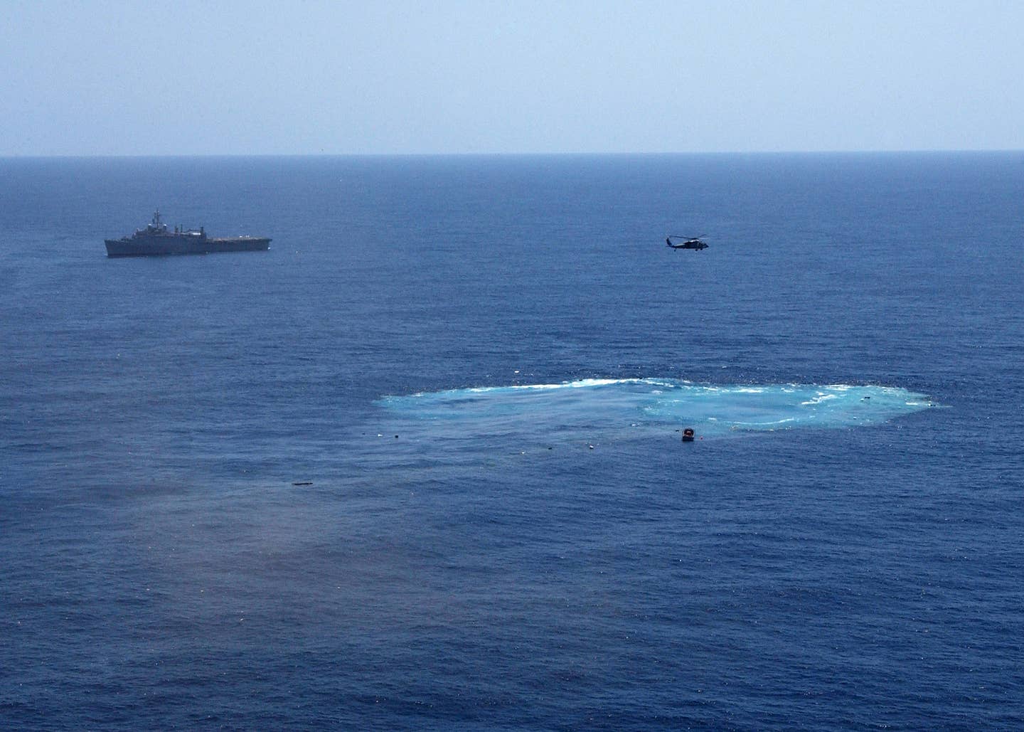 The wake left by <em>America</em> following her use as a live-fire target in 2005; the ship was used as a platform to test how the hull of large aircraft carriers would hold up against underwater attacks. Following the tests, <em>America</em> was scuttled, serving as a further test of the sinking of a large aircraft carrier.<br>(U.S. Navy photo)