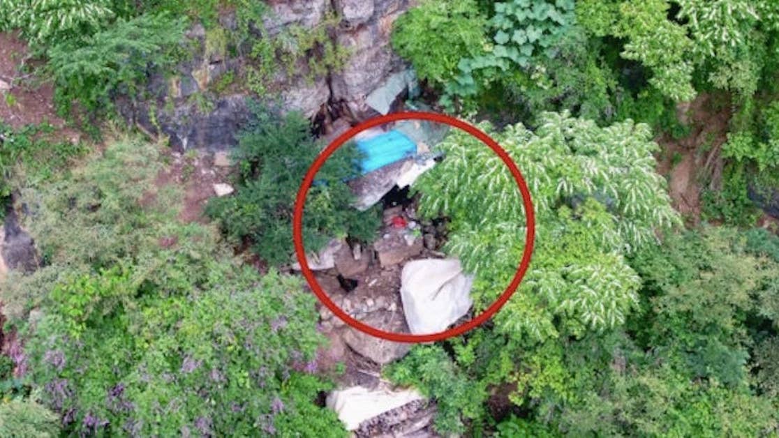 Police drone finds Chinese fugitive living in a hillside cave