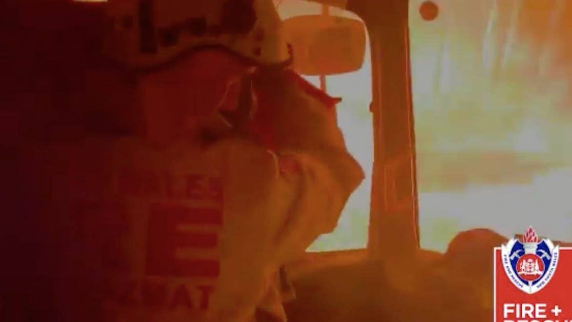 Terrifying video shows rescue crew seeking shelter from bushfire