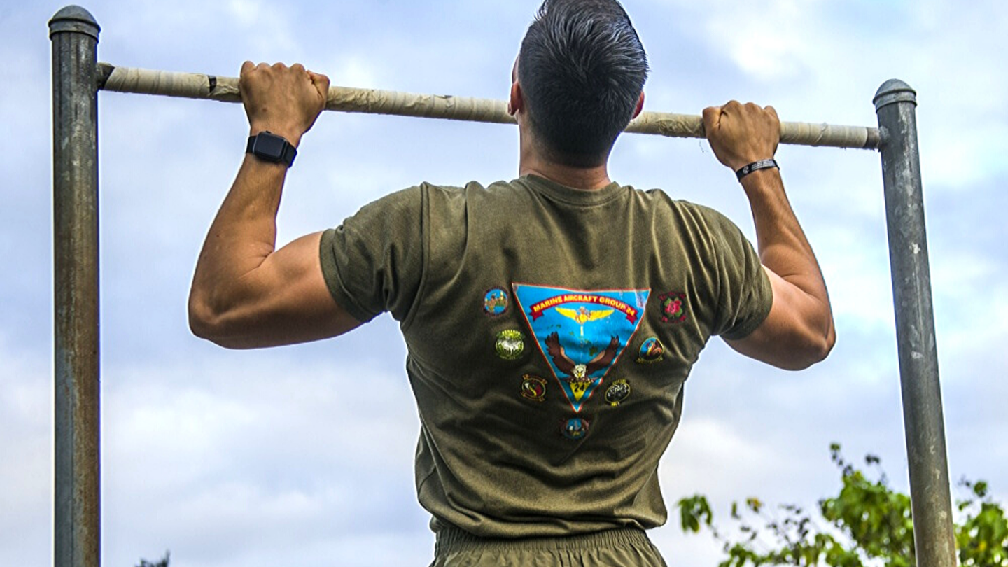 Thumb-over grip is better for mobility on pull-ups but harder on your grip strength.<br>U.S. Marine Corps photo by Lance Cpl. Jacob Wilson