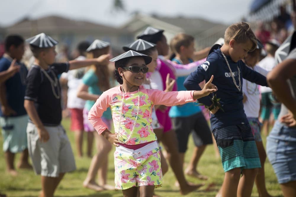 A student with Mokapu Elementary School performs a traditional Hawaiian dance during the school's May Day celebration, Marine Corps Base Hawaii. U.S. Marine Corps/Zachary Orr