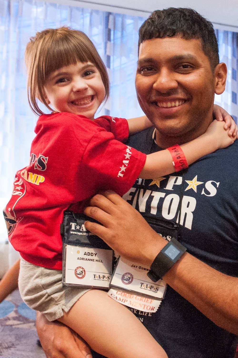 A Gold Star child and her mentor pose for a photo during the 21st annual TAPS National Military Survivor Seminar and Good Grief Camp for Young Survivors, in Arlington, Va., May 22, 2015. Gen. Dempsey addressed surviving family members of fallen service members from both behind a podium and behind a microphone as he sang a few songs. DoD photo/Daniel Hinton