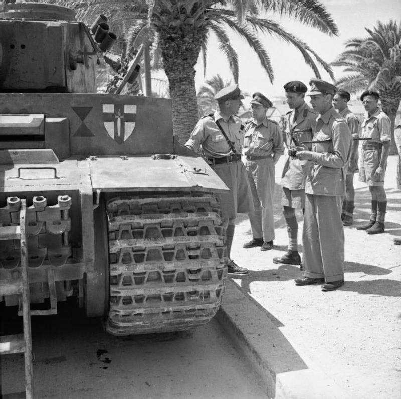 <em>King George VI inspects Tiger 131 in Tunis. (Credit: Imperial War Museum)</em>