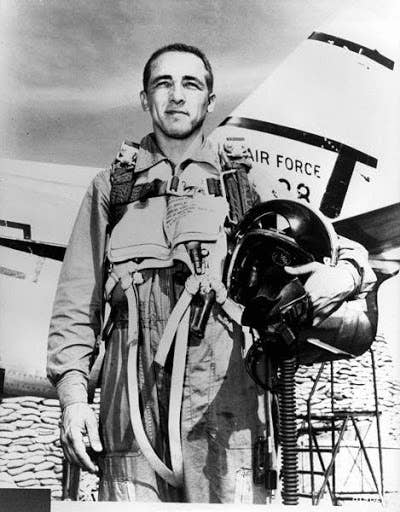 <em>Risner poses in front of an F-86 (Photo by the United States Air Force)</em>