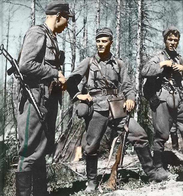 <em>Törni (center) as Finnish Army Lieutenant (Finnish public domain)</em>