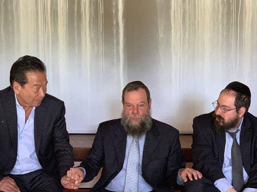 <em>(Left to right) Nobuki Sugihara, Rabbi Yossy Goldman, and Rabbi Yochonon Goldman at Shofuso. (Photo by Sharla Feldsher/Retrieved from WHYY.org)</em>