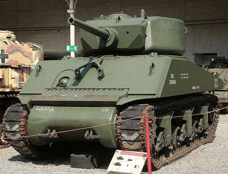 <em>An M4A3E2 Sherman Jumbo on display in Belgium bearing 37th Tank Battalion markings (Photo Credit: Public Domain)</em>
