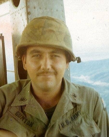 Bob Gunton in his Army uniform poses for a photo