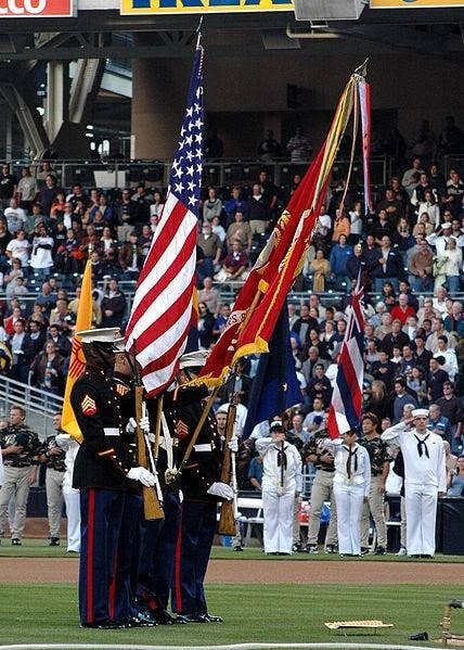 <em>A Marine Color Guard displays the flag during the national anthem at Petco Park (US Navy)</em>