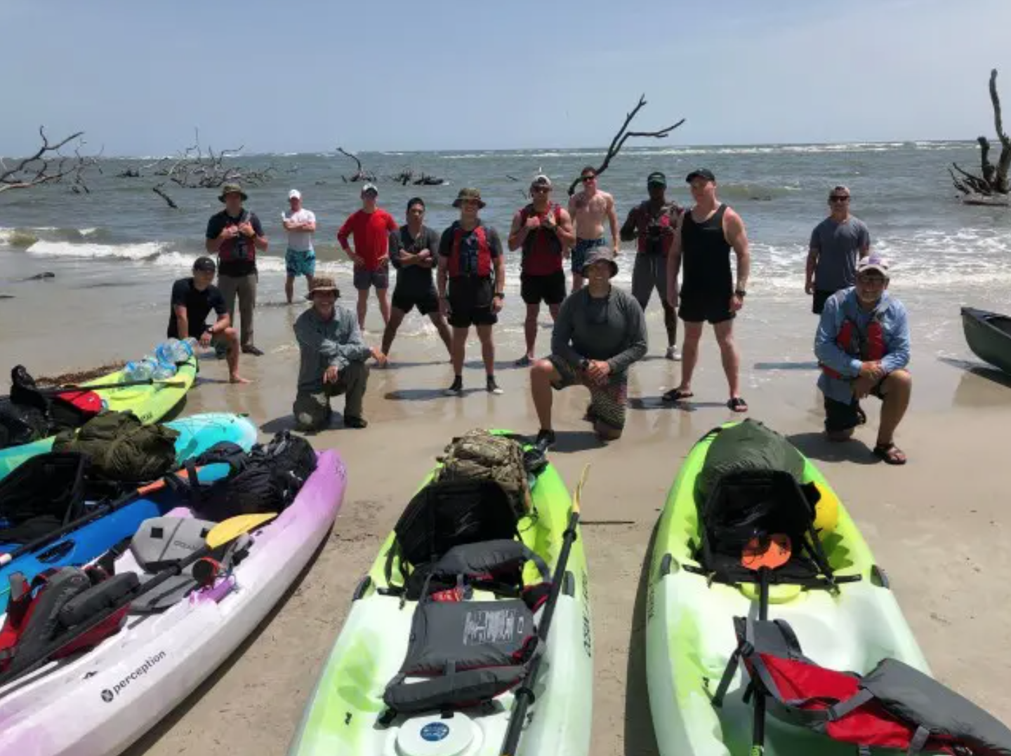 <em>Rangers preparing to launch their kayaks into the ocean (U.S. Army).</em>