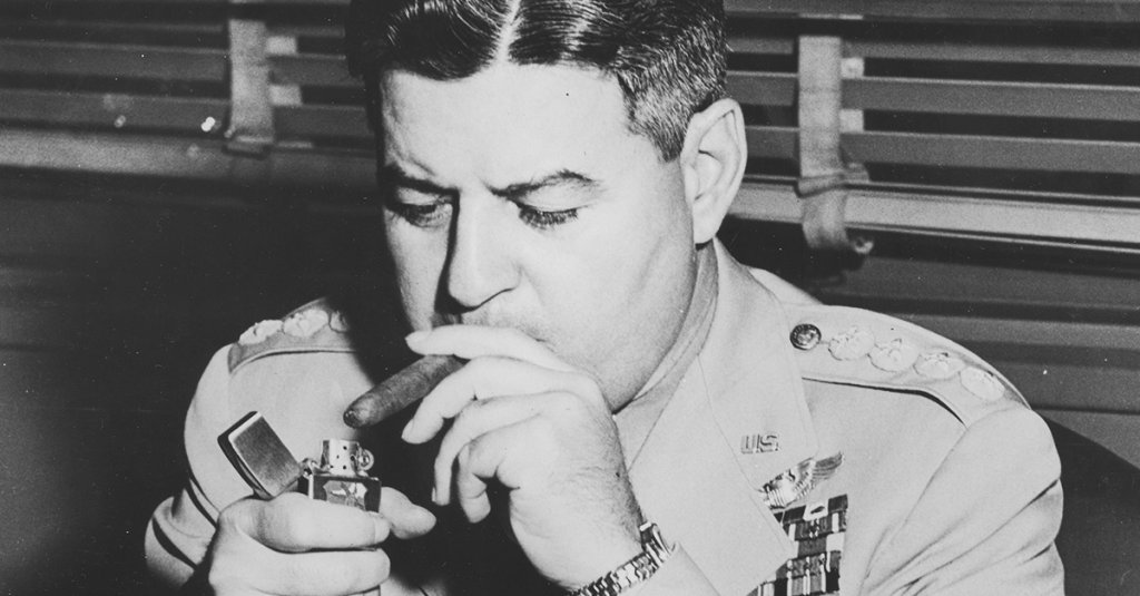 air force general curtis lemay lighting a cigar