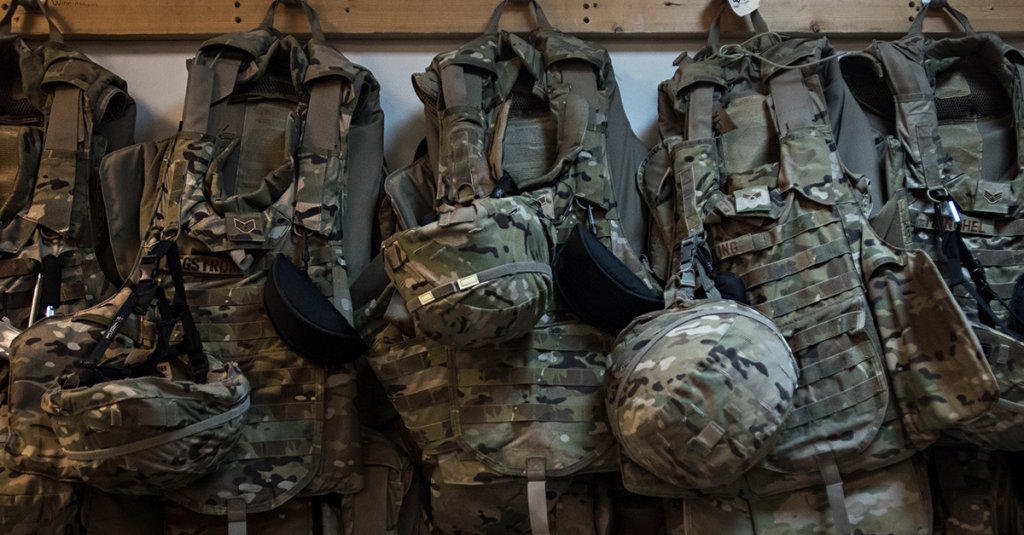 Interceptor body armor belonging to members of the 455th Expeditionary Aircraft Maintenance Squadron hangs from hooks in the C-130J Hercules aircraft maintenance unit Dec. 9, 2016 at Bagram Airfield, Afghanistan.