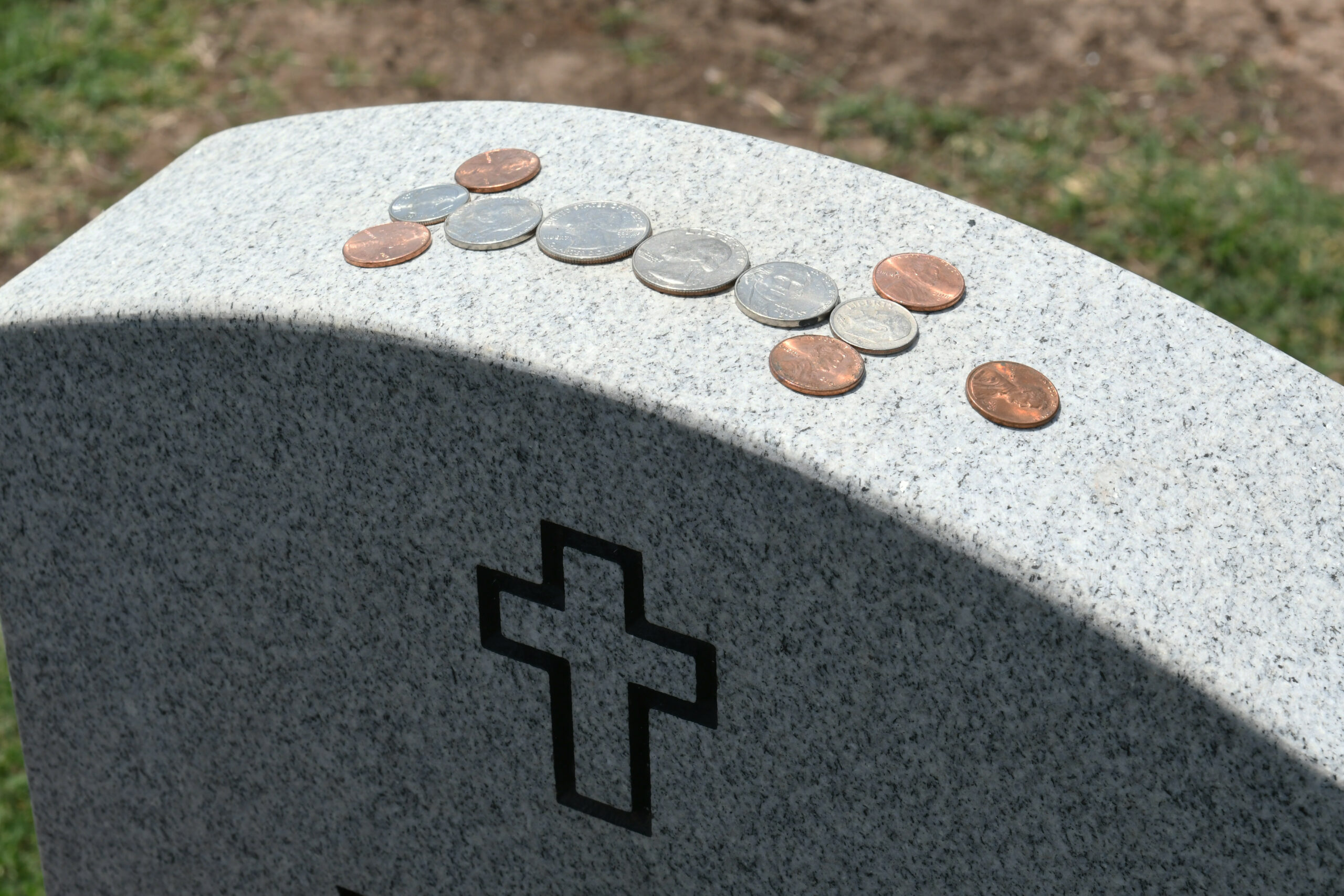 coins on grave