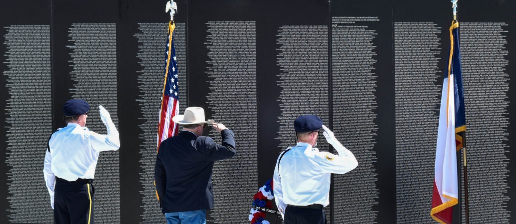 Woman helping to put faces to names on Vietnam Veteran’s Memorial