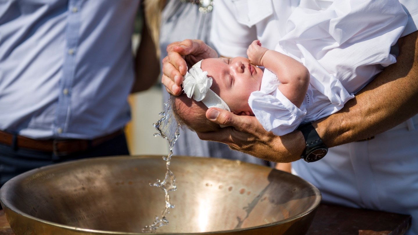 A Navy hero’s descendants baptized on the ship named after him