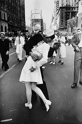 navy sailor kissing woman