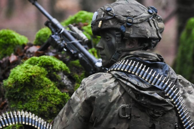 This is why camouflaged troops wearing reflective belts became a thing